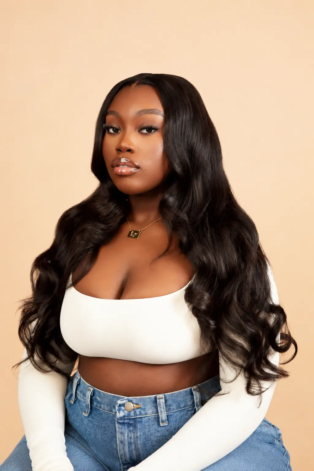 Model wearing long body-wave hair